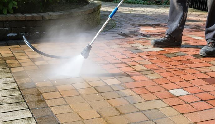 Professional floor cleaning service using high pressure wash