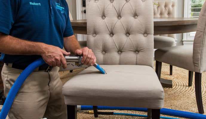 Professional upholstery cleaning service on dining chair