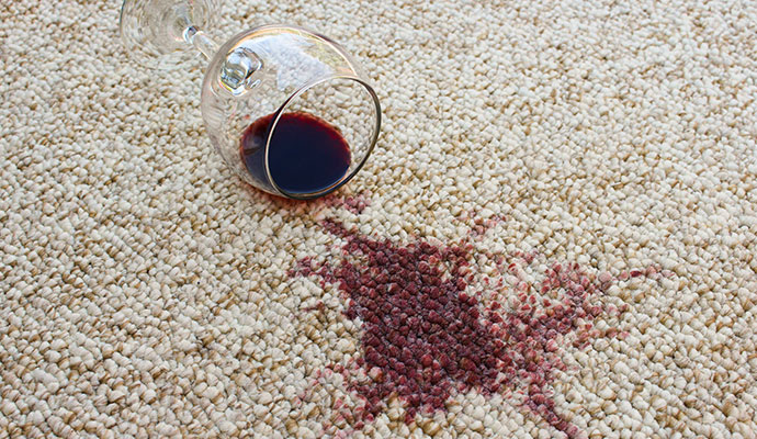 Red wine glass spill on carpet